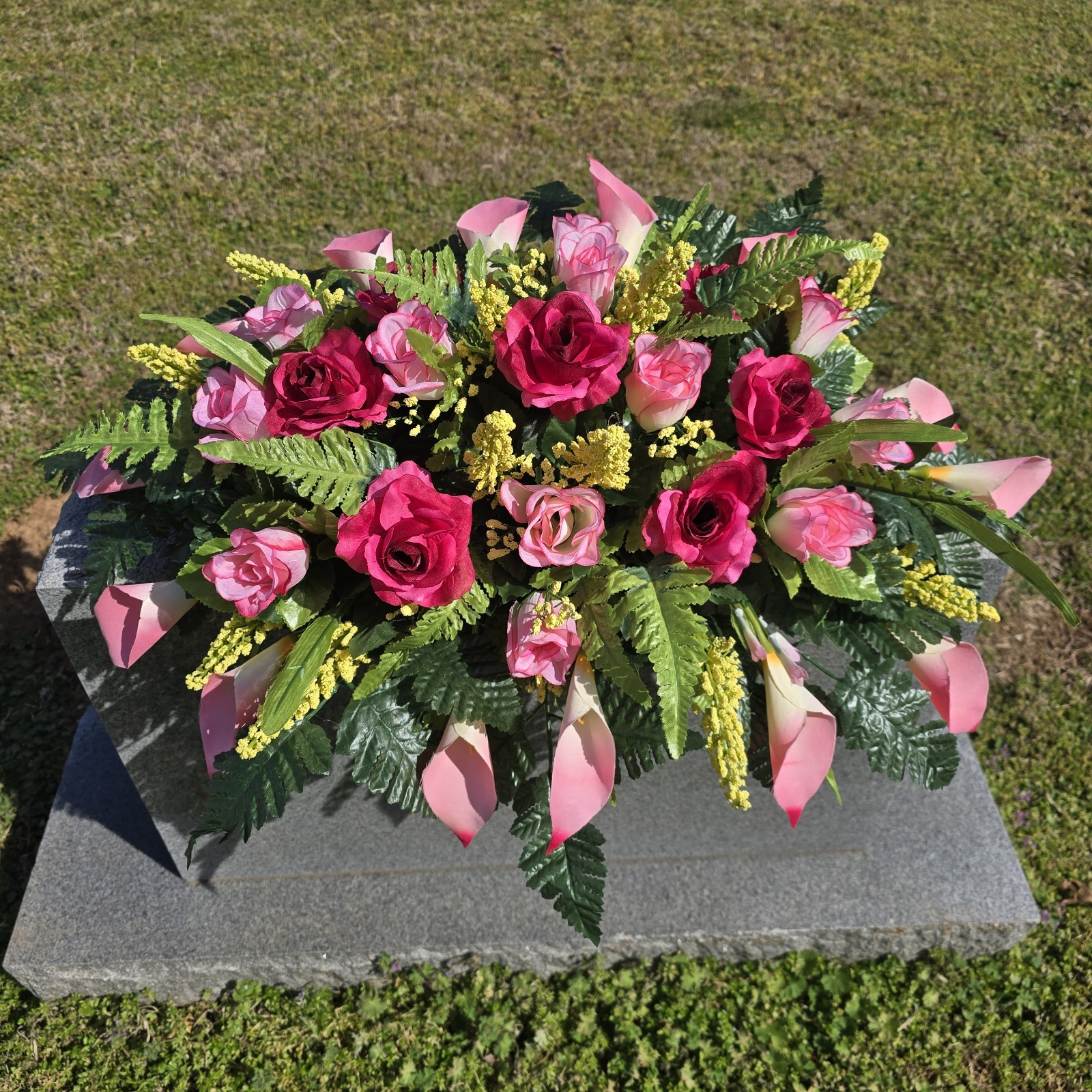 BEAUTY PINK HEADSTONE SADDLE WITH BEAUTY ROSES AND CALLA LILY’S FOR CEMETERY