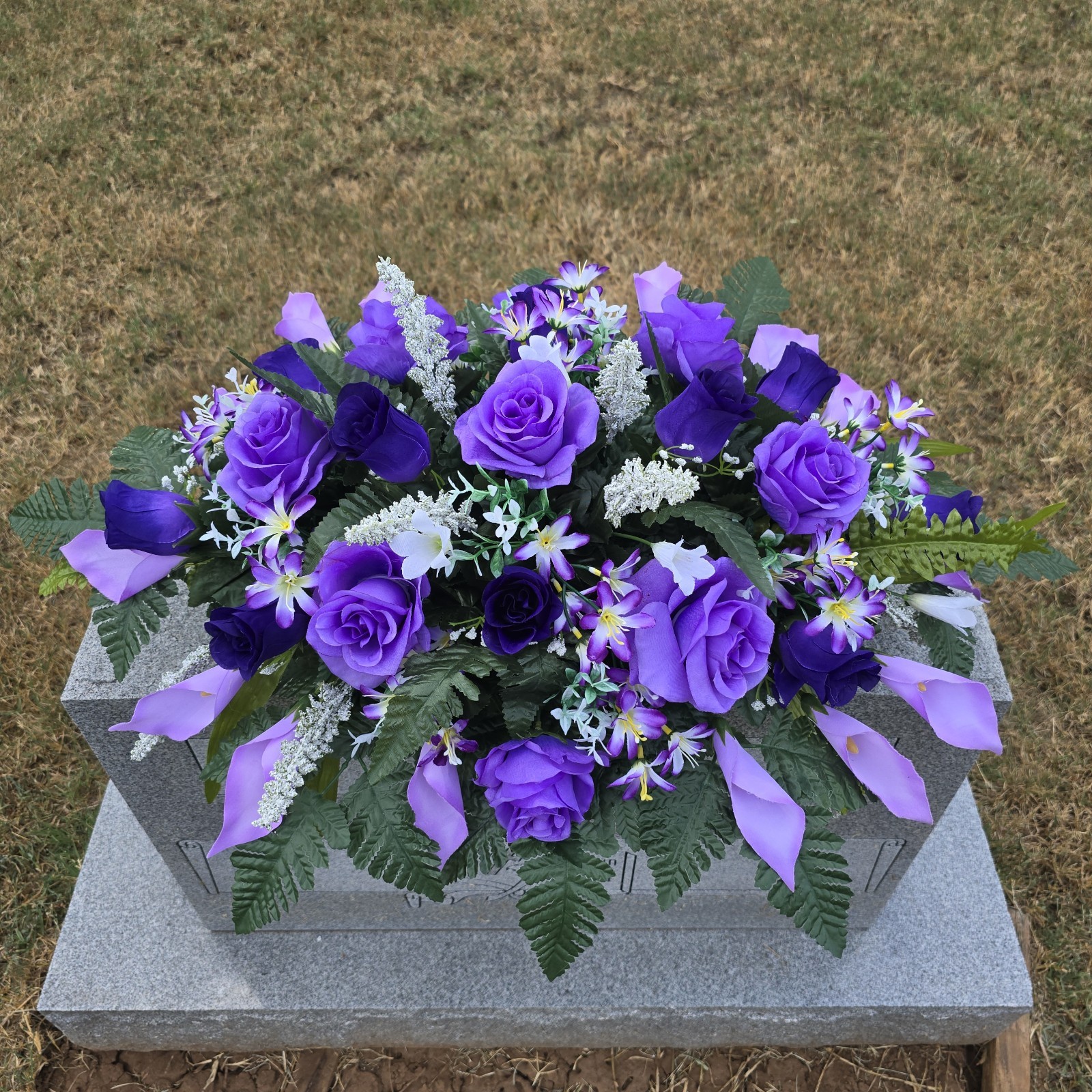 PURPLE HEADSTONE SADDLE WITH PURPLE ROSES & CALLA LILY’S FOR CEMETERY
