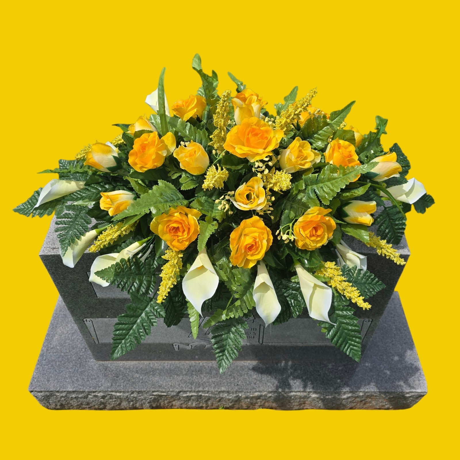 YELLOW HEADSTONE SADDLE WITH YELLOW ROSES AND WHITE CALLA LILY’S FOR CEMETERY