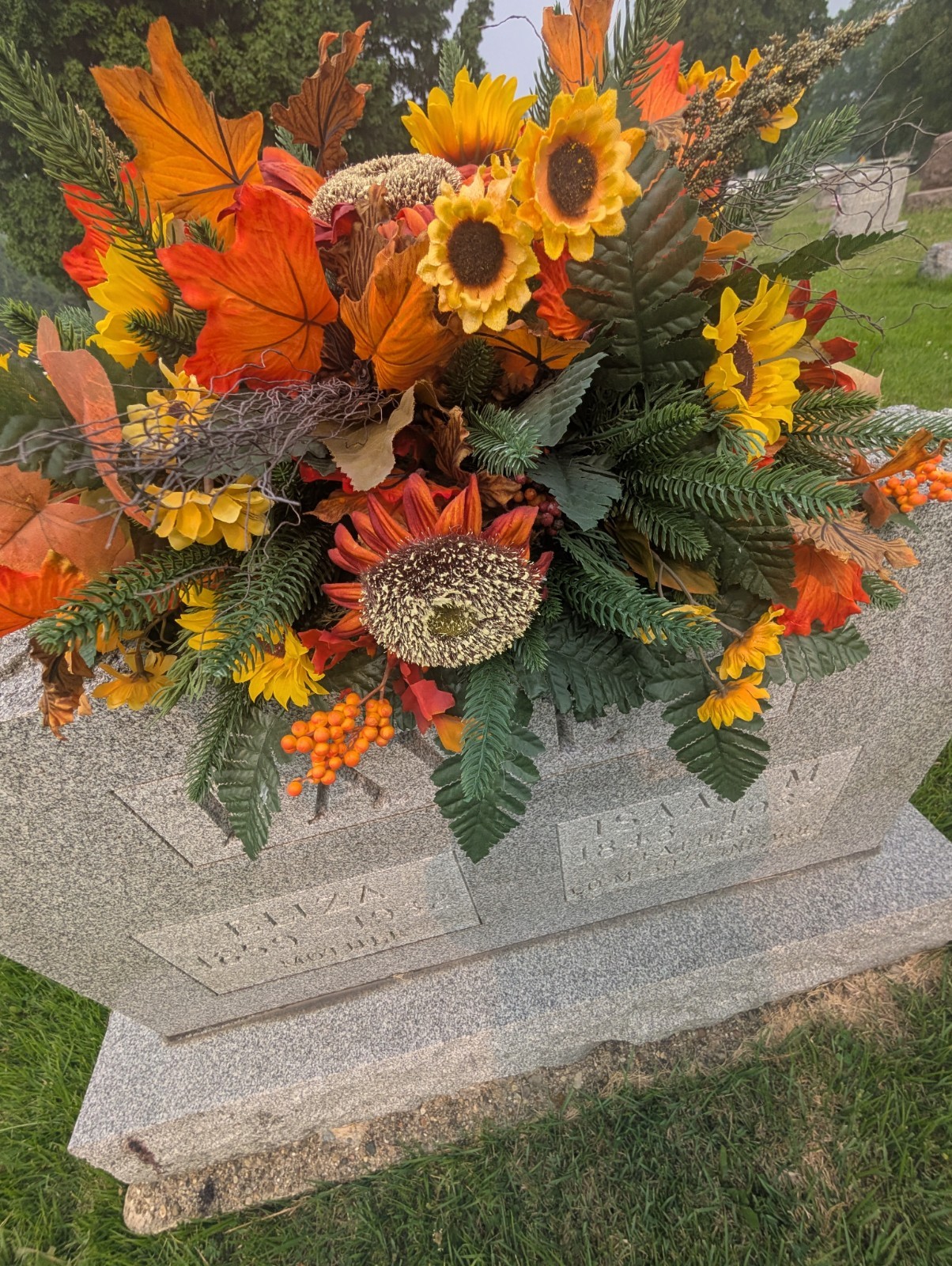 Orange and rust Fall Grave saddle-Sunflower headstone arrangement