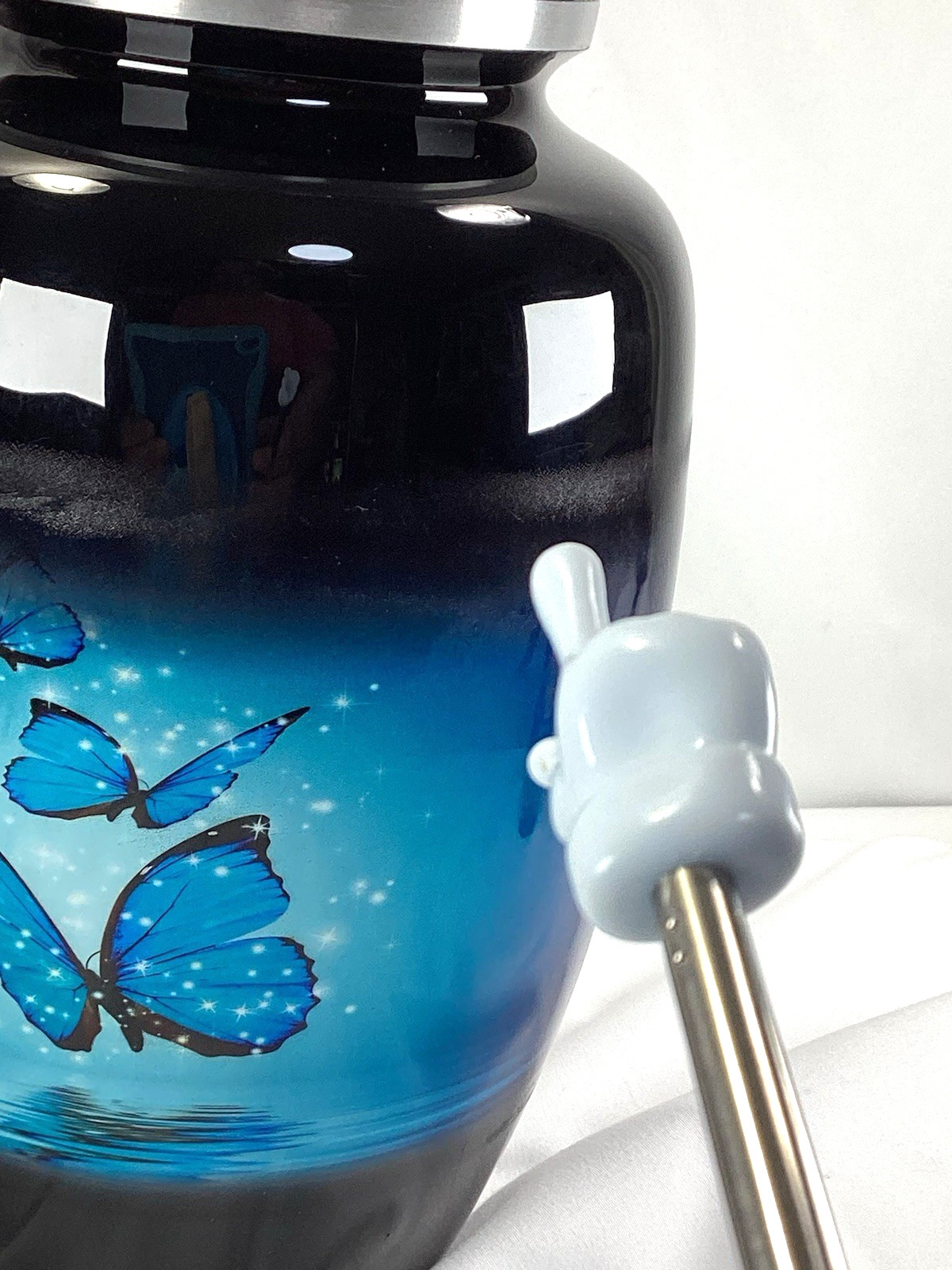 Blue Butterfly Urn, capacity for 200 lbs adult. Roller marks on glaze, see Pics