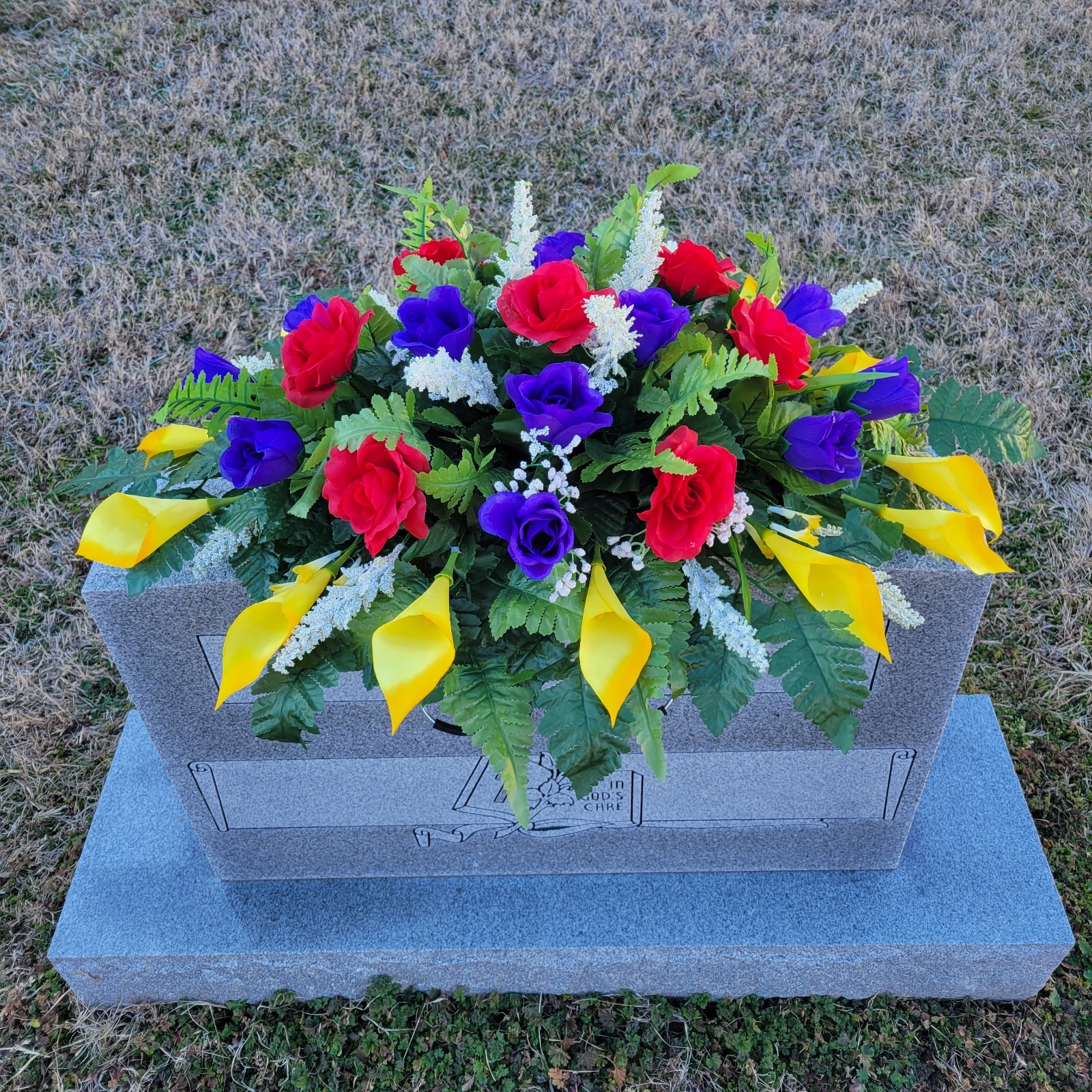 PURPLE/YELLOW/RED HEADSTONE SADDLE WITH ROSES & CALLA LILY’S FOR CEMETERY