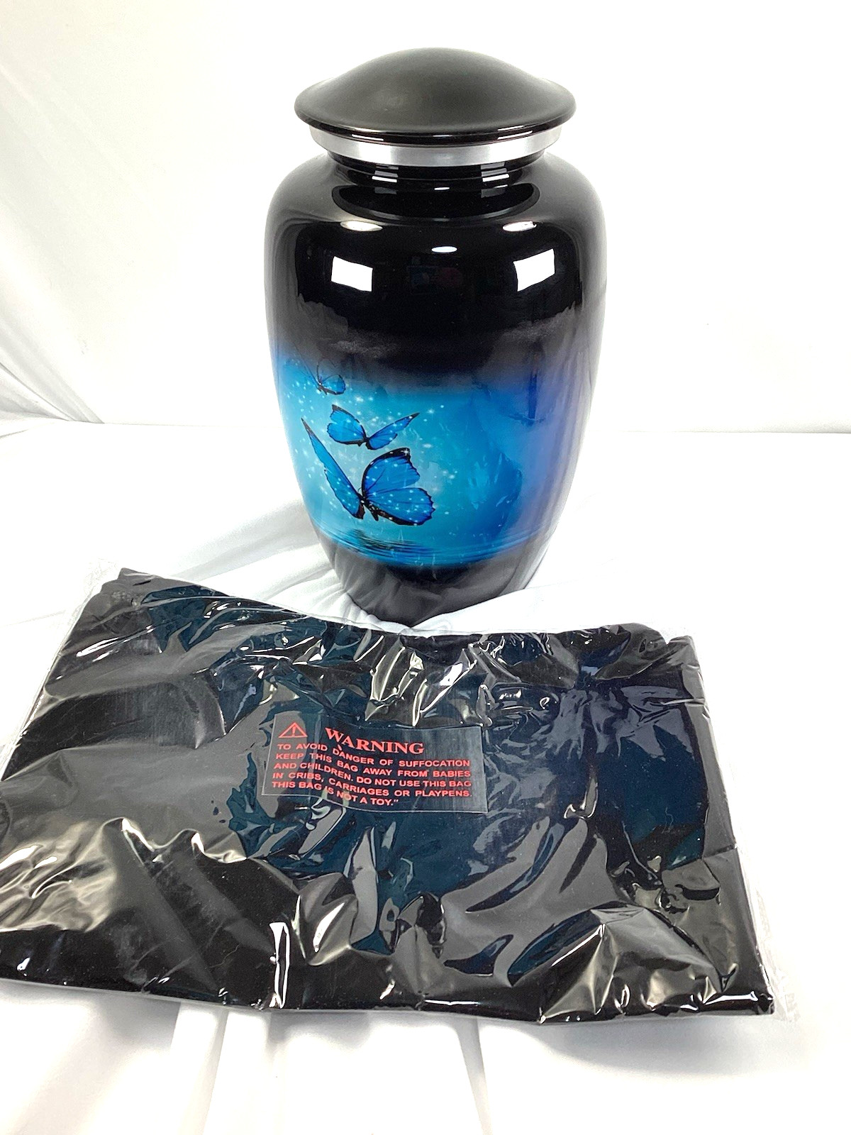 Blue Butterfly Urn, capacity for 200 lbs adult. Roller marks on glaze, see Pics
