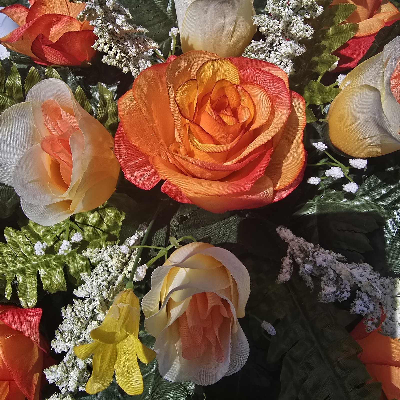 ORANGE AND WHITE HEADSTONE SADDLE WITH ORANGE ROSES & CALLA LILY’S FOR CEMETERY