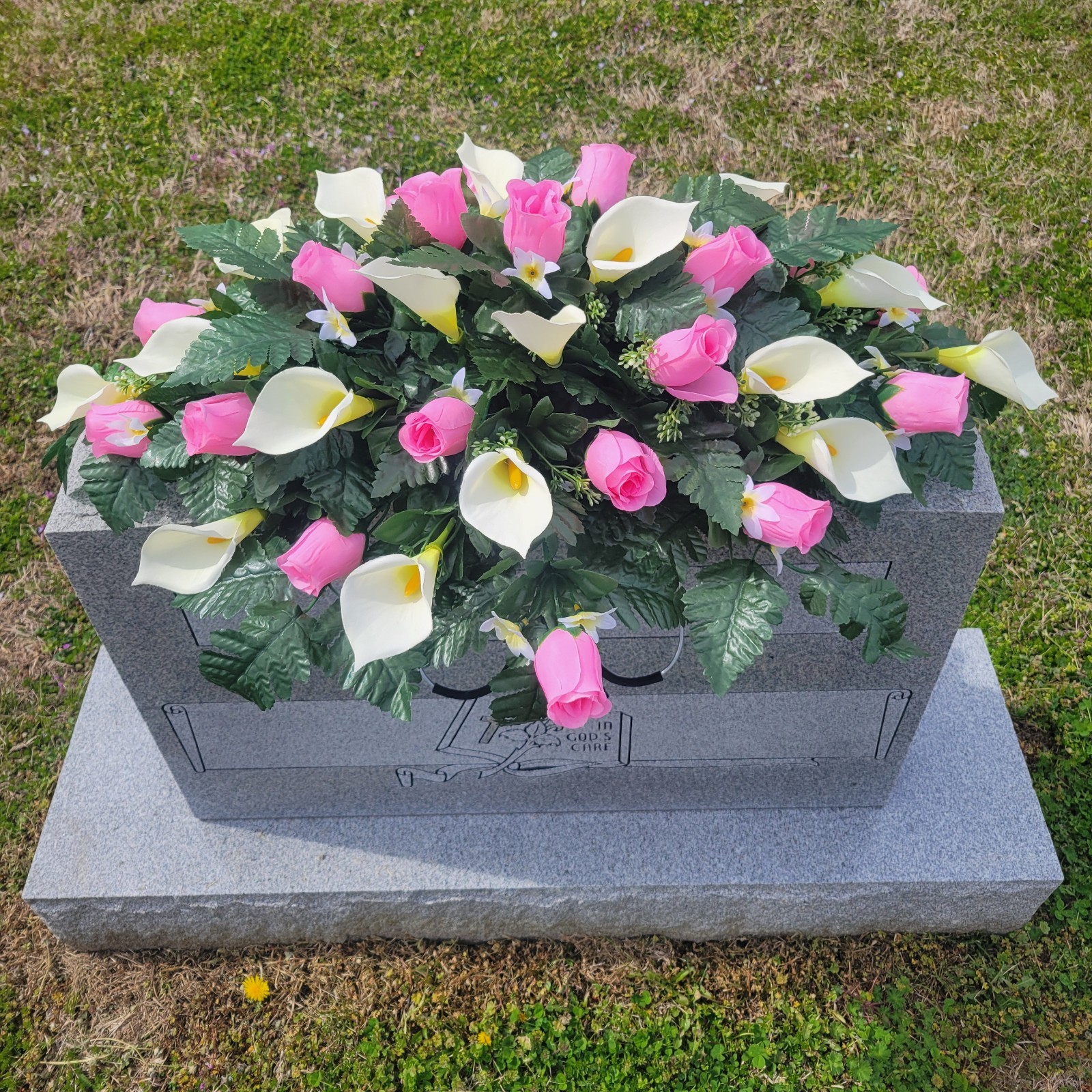 PINK HEADSTONE SADDLE WITH ROSE BUDS & CALLA LILY’S FOR CEMETERY